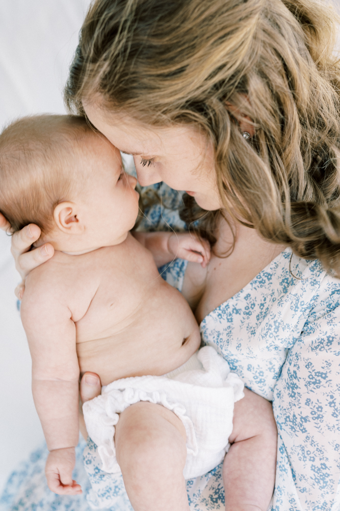 newborn-photographer-columbia-sc-baby-picture-with-mom-kissing-baby