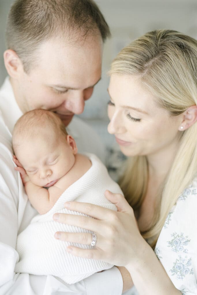 Mom dad with child doing photoshoot